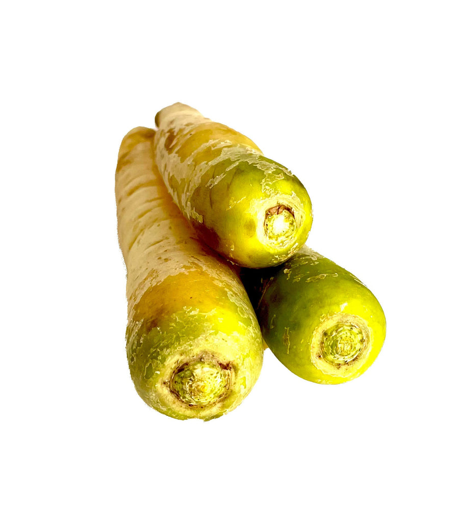 Three yellow carrots on a white background