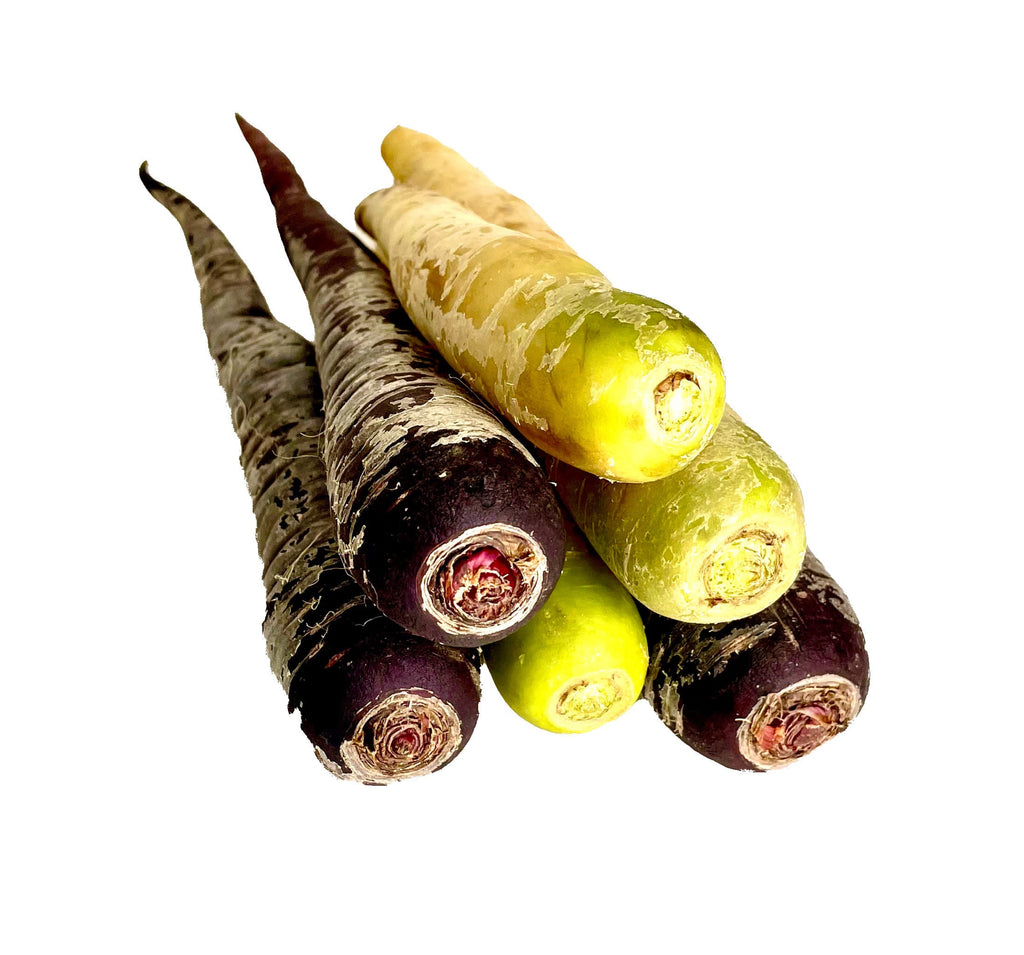 Set of purple, green, and yellow carrots on a white background